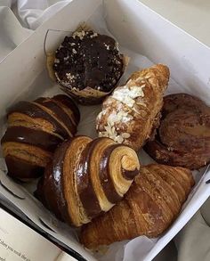 a box filled with different types of pastries