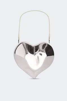 Abstract resin heart shaped bag with custom hardware. The vegan leather strap and chain strap are both detachable providing versatility. This statement piece blends artistry with functionality. Vegan leather lined. Details Model #: S1005-9162-45002 100% RESIN Imported Sizing Height: 24Inches Length: 26inches Depth: 6in Heart Shaped Bag, Heart Bag, Arm Candy, Lifestyle Brands, Chain Strap, Statement Pieces, Vegan Leather, Leather Straps, Heart Shapes