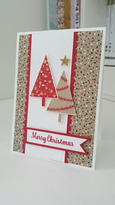 a christmas card with two trees on it