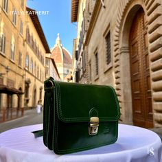 This bag has been made of the best genuine leather by local master crafters of Florence in Italy, designed for women who only accept premium Italian quality and luxury leather bags and modern Italian fashion. . Sizes: Height: 17 cm (6.69 inches) Width: 20 cm (7.87 inches) Depth: 8 cm (3.15 inches) Color: Green . The story of this bag: In the enchanting city of Florence, where the art of leatherwork has been perfected over centuries, a small but renowned workshop stood as a beacon of timeless cra Classic Green Mobile Phone Bag, Luxury Green Bag With Smooth Grain, Classic Green Shoulder Bag With Phone Holder, Classic Green Shoulder Bag With Mobile Phone Holder, Green Leather Flap Bag With Mobile Phone Holder, Elegant Green Saddle Bag For Everyday Use, Elegant Green Saddle Bag For Travel, Green Rectangular Leather Saddle Bag, Green Leather Rectangular Saddle Bag