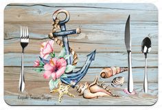 an anchor, seashells and shells on a wooden table with utensils