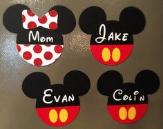 three mickey mouse magnets with the words mom, take and evan written on them