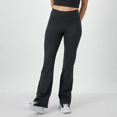 Cut to a mid-rise this pair of Champion women's pants are made from soft recycled fabric with stretch for added comfort. They have a smooth elastic-waistband with slim fitting flare legs. Wear them with a sports bra and grippy socks to move into yoga poses.Front Style: Flat FrontFeatures: Comfort WaistbandClosure Type: Full ElasticFit: Slim FitRise: Mid RiseFiber Content: 78% Recycled Polyester, 22% SpandexFabric Description: WovenInseam: 31 1/2 InLeg Style: Flare LegCare: Tumble Dry, Machine Wa Solid Compressive Mid-rise Pants, Casual Recycled Polyester Pants, Workout Mid-rise Bottoms With Comfort Waistband, Sporty High Stretch Bottoms With Comfort Waistband, High Stretch Sporty Bottoms With Comfort Waistband, Fitted Recycled Polyester Bottoms For Sports, Compressive Mid-rise Sporty Bottoms, Athleisure Compressive Bottoms With Comfort Waistband, Compressive Athleisure Bottoms With Comfort Waistband