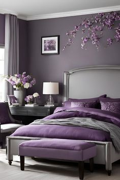 a bedroom decorated in purple and silver with flowers on the wall above the bed, along with two chairs