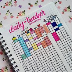 the daily tracker book is open and ready to be filled with colorful things on it