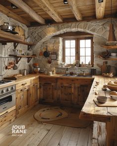 a rustic kitchen with stone walls and wooden floors