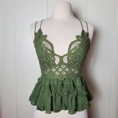 -Super Cute Olive Green Tank Top With Lace On The Top And Has Ruffled Material At The Bottom -Top Lace Part Has Triangle Lined Cup Coverage But Is See Threw Alittle On The Front And The Back -V Neckline -Smocked Back -Has Crisscross Spaghetti Adjustable Straps -Super Comfy And Stylish Tank Top -New With Tags. No Damages Size: S, M Available Green Lace Cami Top, Green Bohemian Lace Tops, Green Lace Bohemian Tops, Green Lace Tops For Spring, Green Lace Trim Top For Vacation, Olive Green Tank Top, See Threw, Outfit Pieces, Stylish Tank Tops