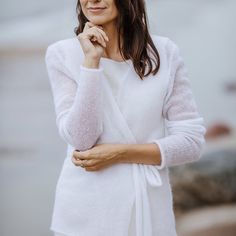 "Mohair silk pure white cardigan, wedding white silk mohair jacket, bridal silk pullover, wedding accessories, soft white mohair bridal shrug This knitted sweater is my absolute love. This model is one of the most popular among our clients. Transparent knitwear will look great as a spring or summer image and even winter. :) To create this model, I used the yarn of the famous manufacturer Drops. It perfectly emphasizes the silhouette and line of the bust. The sweater is soft to the touch, is 75 m Bridal Knitwear, Bridal Sweater, Knitting Fashion, Bridal Shrug, Fall Fashions, White Clothing, Silk Cardigan, Minimal Classic, Wedding White