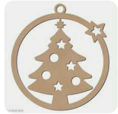 a wooden ornament with a christmas tree in the center and stars on it