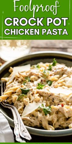 chicken pasta with parmesan cheese and herbs in a skillet on a wooden table