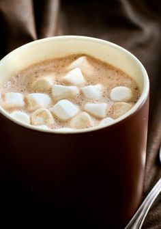 a cup of hot chocolate with marshmallows in it