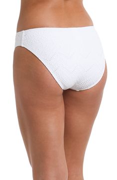 Delicately adorned with a subtle sand-inspired design, this hipster bottom exudes both vibrancy and a touch of coastal elegance. This playful and energetic design is perfect for a day spent lounging on the beach or soaking up the sun by the pool. [split] Details Hipster Bottom Moderate rear coverage Fabric 94% Nylon, 6% Elastane Seamless Summer Bottoms For Beach, Casual Textured Swimwear For Beach, Casual Textured Swimwear For Vacation, Casual Textured Beach Swimwear, Textured Swimwear For Spring Beach Outings, Textured Swimwear For Beach In Spring, Beachy Seamless Bottoms, Seamless Beachy Bottoms For Beach Season, Beachy Seamless Bottoms For Vacation