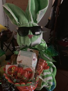 a stuffed bunny with sunglasses and some candy