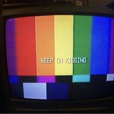 an old tv with the words keep on kissing written on it's screen in color bars