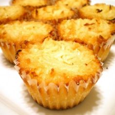 several small muffins on a white plate