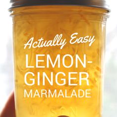 a hand holding a jar of lemon ginger marmalade with the words actually easy on it