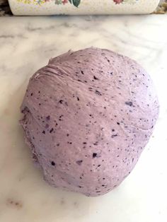 a ball of dough sitting on top of a counter