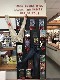 there is a display in the library with books and scarves on it's wall