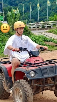 a man riding on the back of an atv