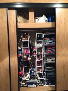 the closet is full of shoes and purses for all kinds of people to use