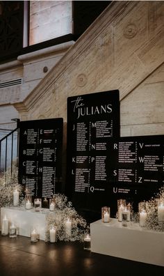 candles are lined up in front of the menus