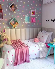 a child's bedroom decorated in pastel colors