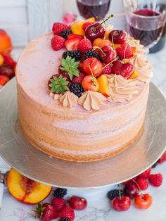 a close up of a cake with fruit on top