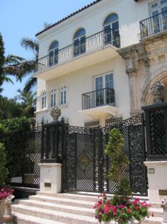 a large white house with many windows and balconies