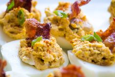 deviled eggs topped with bacon and green onions