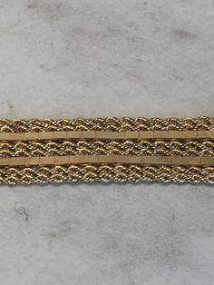 "This one-of-a-kind custom-made 14kt Yellow Gold Lady's Bracelet consists of 6- 1mm Solid Rope Chains and 2 Mirror Shiny Box Chains soldered together to create this unusual pattern style 7\" in length. This bracelet has a hidden solid box clasp with a secure fig 8 safety clasp. This bracelet weighs 14.5 grams. This item would Retail for $2,280.00" Gold Bracelet With Decorative Band As Gift, Gold Bracelets With Decorative Band As Gift, Formal Yellow Gold Bracelet With Decorative Band, Gold Bracelet With Decorative Band For Anniversary, Rectangular Gold Bracelet With 17 Jewels, Gold Rectangular Bracelets For Formal Occasions, Yellow Gold Jewelry With Jubilee Bracelet And Rectangular Shape, Yellow Gold Rectangular Bracelet For Anniversary, Yellow Gold Bracelet For Anniversary