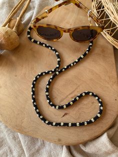 Handmade glasses chain or necklace  I string the beads one by one and then knit them. It is not gluing. Trendy Black Glasses Chains For Gift, Handmade Black Necklaces For Summer, Handmade Black Necklace For Summer, Gift Black Beaded Glasses Chains, Black Beaded Glasses Chains As Gift, Black Round Beads Glasses Chains As Gift, Black Beaded Glasses Chains For Gift, Black Beaded Glasses Chains As Fashion Accessory, Black Beaded Glasses Chains For Festival