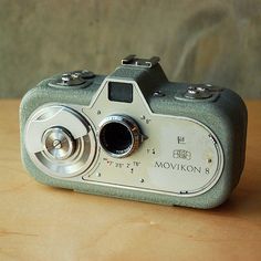 a camera sitting on top of a wooden table