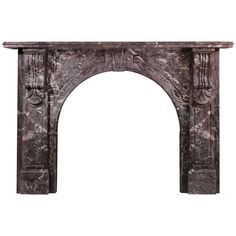 an antique fireplace surround made of marble