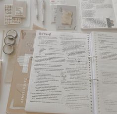 the contents of a planner spread out on a table with scissors, pens and other items