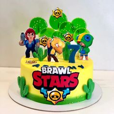 a birthday cake decorated with cartoon characters and cactuses for brawl star's party