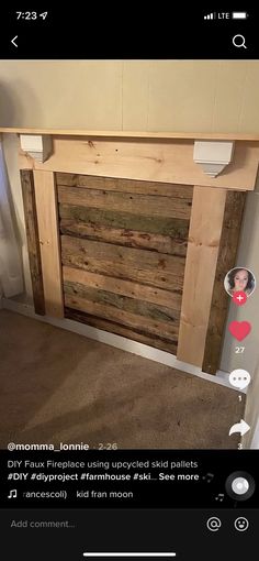 a bed frame made out of pallets and some kind of wood with buttons on it