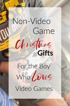 a boy holding a video game in his hands with the words non - video game christmas gifts for the boy who loves video games