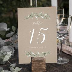 the table numbers are displayed in front of wine glasses