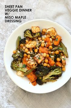 a white bowl filled with vegetables and chickpeas