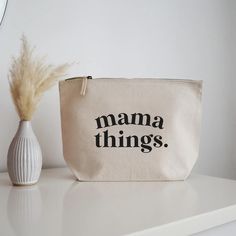 Keep your Mama things organised with our zipped cotton canvas pouch bag. A great pouch to use for nappies and wipes or toddler toys and snacks.  DETAILS - Available with black or sand coloured text.  - This bag is made from 100% brushed cotton canvas with a sturdy vintage style metal zip closure. - Dimensions: 13cm x 19.5cm x 6 cm All orders are hand-wrapped, complete with shredded paper and tied up in a bow.  If you wish to send a gift message along with your gift box, simply write your message Cosmetic Bag Design, Cosmetics Bag, Canvas Pouch Design Ideas, Eco-friendly Canvas Pouch Bag For Everyday, Customizable Pouch Bags, Everyday Pouch Bag With Letter Print, Canvas Pouch Cosmetic Bag For Gift, Canvas Zipper Pouch Cricut, Funny Makeup Bag