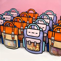 an assortment of purses sitting on top of a white table next to each other