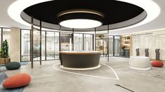 the interior of a modern office with circular lighting