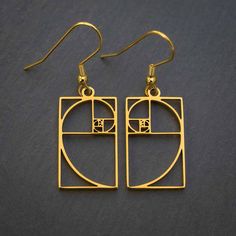 Fibonacci sequences are the basis for some of nature's most amazing creations. Besides being useful for architecture, financial market analysis, and various data algorithms, Fibonacci numbers are also spectacularly beautiful. These silver or gold colored steel earrings display the mathematical elegance of the Fibonacci sequence. Made from non-tarnishing metal, they are both delicate in design and very strong. They are hung from gold plated or stainless steel ear wires. For the ultimate classy in Minimalist Spiral Metal Jewelry, Modern Cadmium-free Earrings As A Gift, Minimalist Gold Spiral Jewelry, Modern Jewelry With Unique Spiral Design, Geometric Gold Nickel-free Jewelry, Nickel-free Geometric Gold Jewelry, Gold Geometric Nickel-free Jewelry, Gold Spiral Minimalist Earrings, Modern Gold Spiral Jewelry