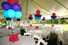 tables and chairs are set up under a tent with balloons