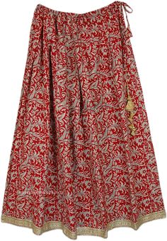 A classy royal vintage long cotton skirt with paisley motifs, highlighted with a golden brocade on the hem and a shimmery royal vintage tassel on the drawstring. The skirt looks dainty and glamorous vintage with just the drawstring, not an elastic, making it versatile and adjustable over a wide range of waist. #tlb #MaxiSkirt #Dance #Floral #Printed #Indian #IndianSkirt #GarbhaDress #DandiyaSkirt Festive Bohemian Cotton Skirt, Traditional Red Cotton Skirt, Traditional Long Cotton Wrap Skirt, Traditional Red Flared Maxi Skirt, Traditional Tiered Festive Maxi Skirt, Traditional Tiered Maxi Skirt For Festive Season, Traditional Tiered Skirt For Festivals, Traditional Red Lined Maxi Skirt, Traditional Tiered Wrap Skirt With Lining