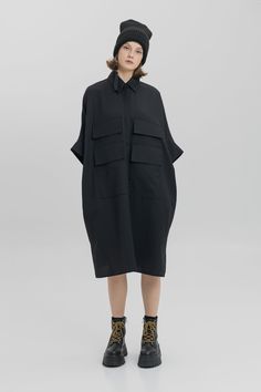 Black Relaxed Fit Tunic For Spring, Casual Oversized Tunic With Pockets, Oversized Summer Workwear Tunic, Oversized Summer Tunic For Workwear, Oversized Black Casual Tunic, Oversized Cotton Tunic For Fall, Relaxed Fit Short Sleeve Tunic For Fall, Fall Tunic With Relaxed Fit And Short Sleeves, Fall Short Sleeve Relaxed Fit Tunic