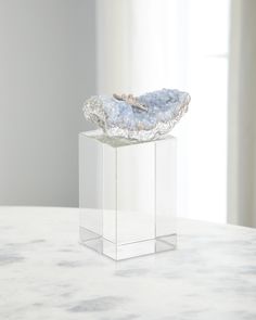 a piece of glass sitting on top of a table