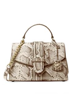 Pretty python-printed leather covers the Bleecker satchel for a seriously sophisticated take on a classic silhouette.Small sized bag 10"W x 6-3/4"H x 3-3/4"D (width is measured across the bottom of handbag)3"L handles; 22-1/2"L adjustable removable strapMagnetic flap closure18K gold-tone exterior hardware & 1 back slip pocket1 interior zip pocket & 1 slip pocketLeatherColor: Natural Luxury Chic Medium Satchel, Luxury Rectangular Satchel With Silver-tone Hardware, Cheap Office Shoulder Bag With Gold-tone Hardware, Modern Luxury Medium Satchel, Luxury Michael Kors Formal Satchel, Luxury Large Capacity Gold Satchel, Luxury Beige Pebbled Leather Satchel, Luxury Satchel Shoulder Bag For Shopping, Luxury Silver-tone Hardware Satchel Bag