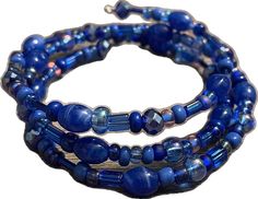 Blue Multi-strand Hand-strung Bracelet, Adjustable Beaded Blue Stretch Bracelet, Adjustable Blue Beaded Stretch Bracelet, Blue Wrap Bracelet With Colorful Beads As Gift, Adjustable Beaded Blue Wrap Bracelet, Blue Hand-strung Multi-strand Bracelet, Adjustable Blue Beaded Wrap Bracelet, Blue Wrap Bracelet With Colorful Beads For Gifts, Adjustable Blue Wrap Bracelet With Faceted Beads