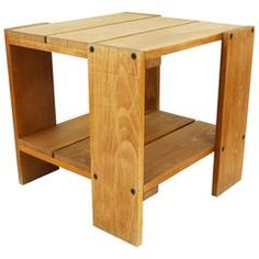 a small wooden table sitting on top of a white floor